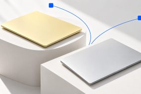 Yellow and silver laptops side by side for a MacBook Neo and Air comparison.